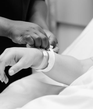 nurse helping mother in labor