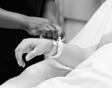 nurse helping mother in labor