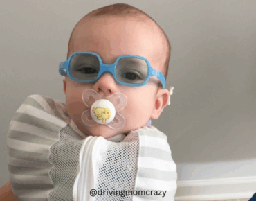 baby with sunglasses for tongue ties and breastfeeing
