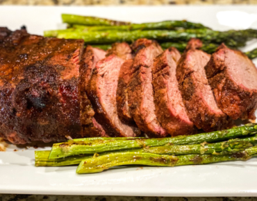 smoked tri-tip served with asparagus