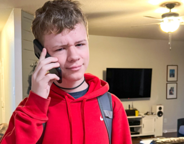 teen holding phone learning about how to keep teens safe online