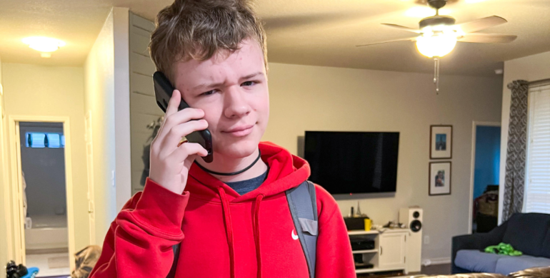 teen holding phone learning about how to keep teens safe online