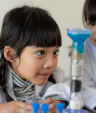 kids looking at microscope- science gifts for kids